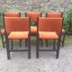 Series of 6 vintage chairs in orange fabric and black lace-up.