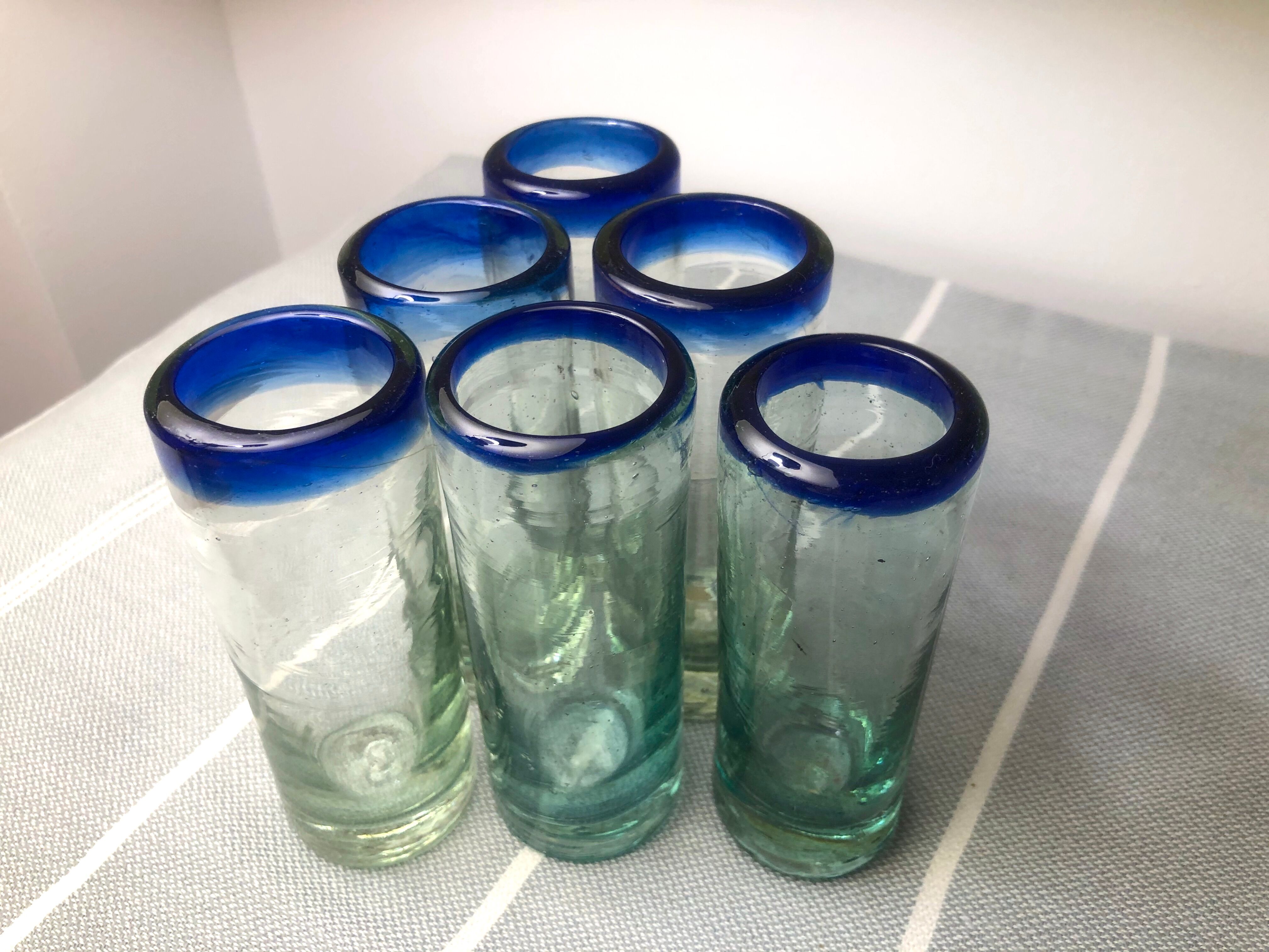 Handmade cobalt blue tequila glasses made of recycled glass