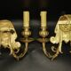 Pair of wall sconces with grotesque heads in 19th-century Renaissance style - bronze