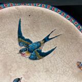 Round polychrome enamel dish with bird decoration circa 1900