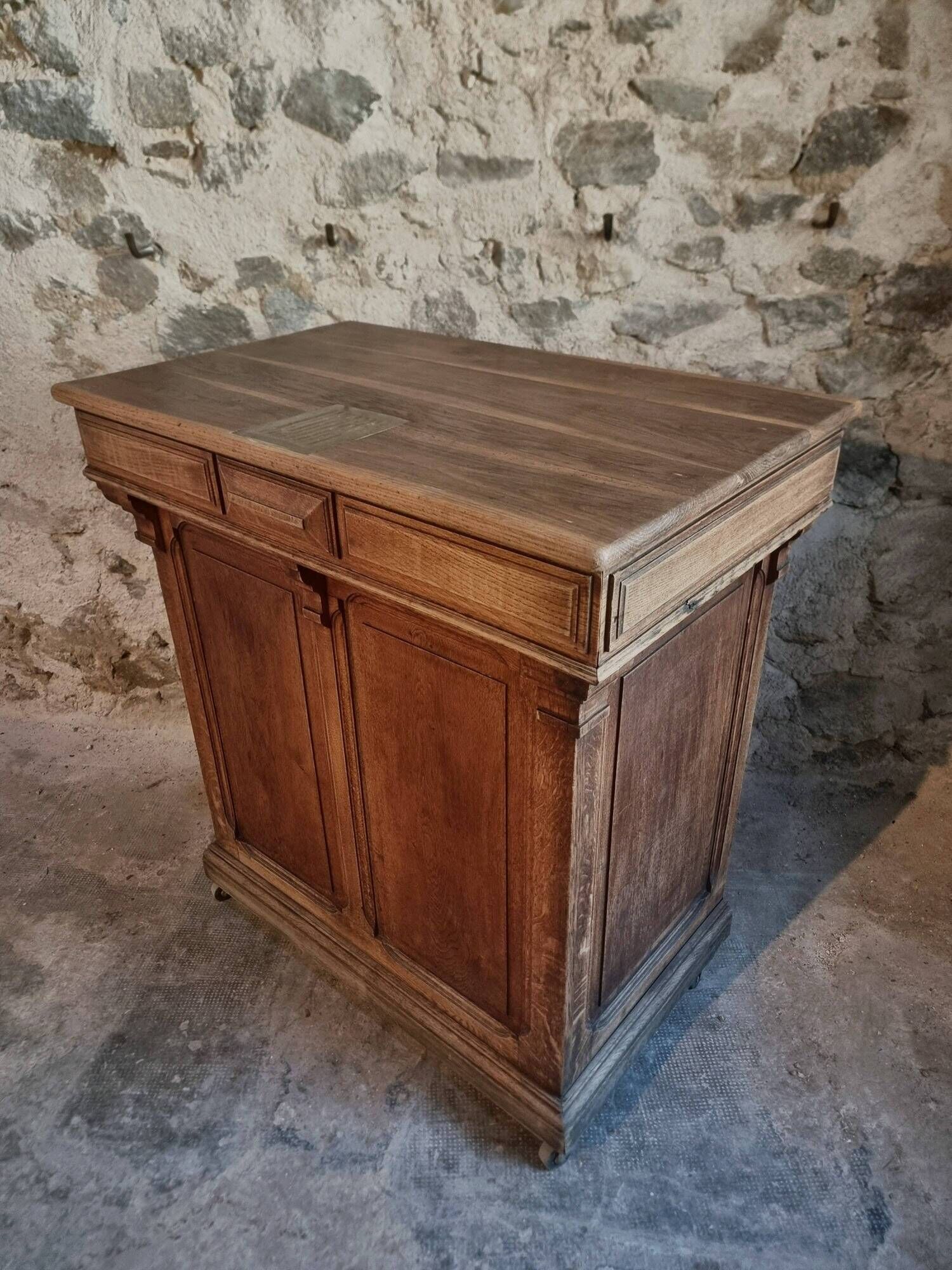 Antique French oak shop counter, kitchen island on wheels, circa 1880–1900.