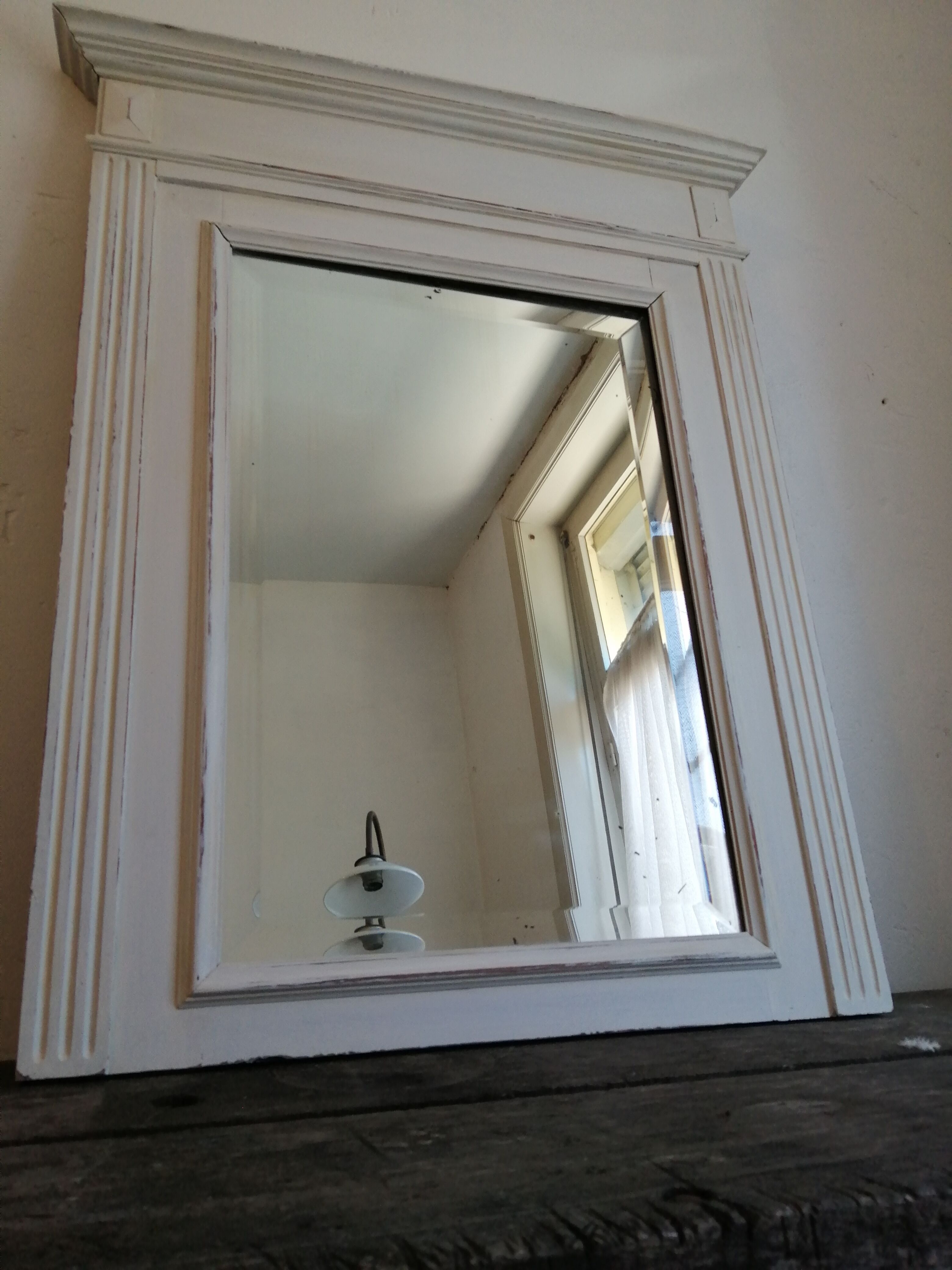 Beveled fireplace mirror