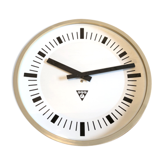 Beige industrial bakelite wall clock from Pragotron, 1970s
