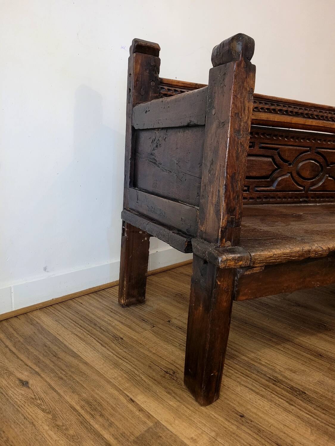 Antique carved solid wood bench from the early 20th century