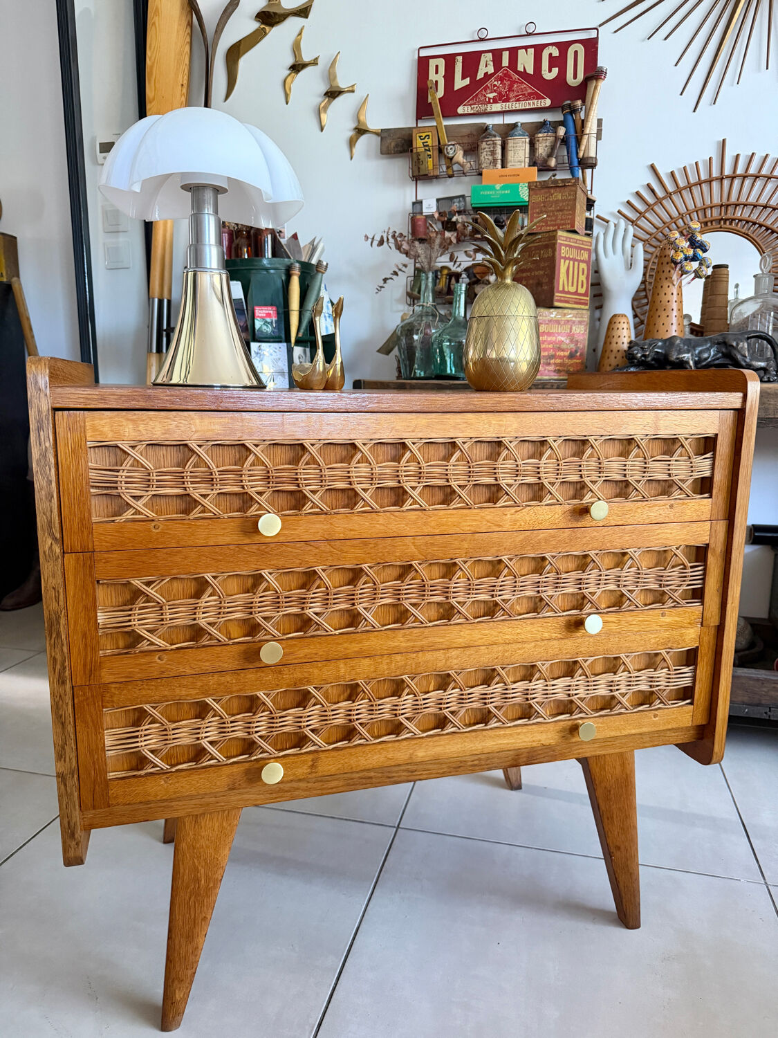 Vintage wooden and rattan chest of drawers with tapered legs.