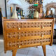 Vintage wooden and rattan chest of drawers with tapered legs.