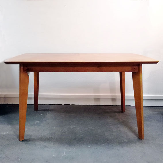 Dining table with compass feet