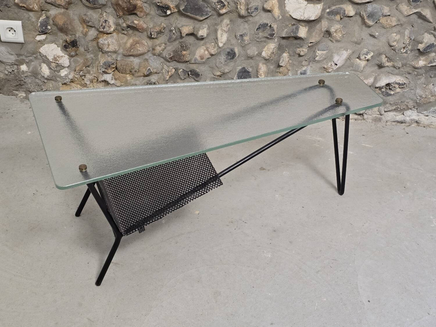 Coffee table in glass and black lacquered metal