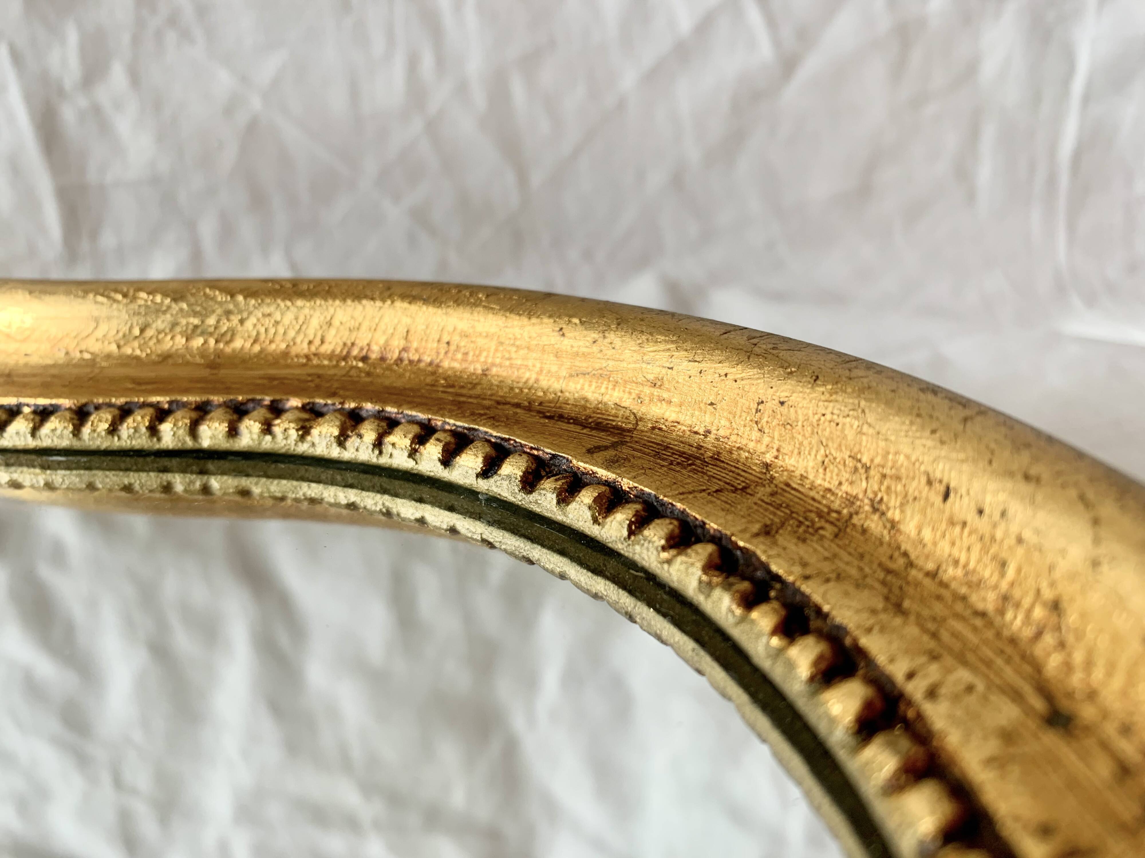 Vintage wall mirror in gilded wood