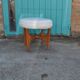 Mid-century ottoman in teak and off-white leather by Kofod Larsen for G-Plan, 1960s.