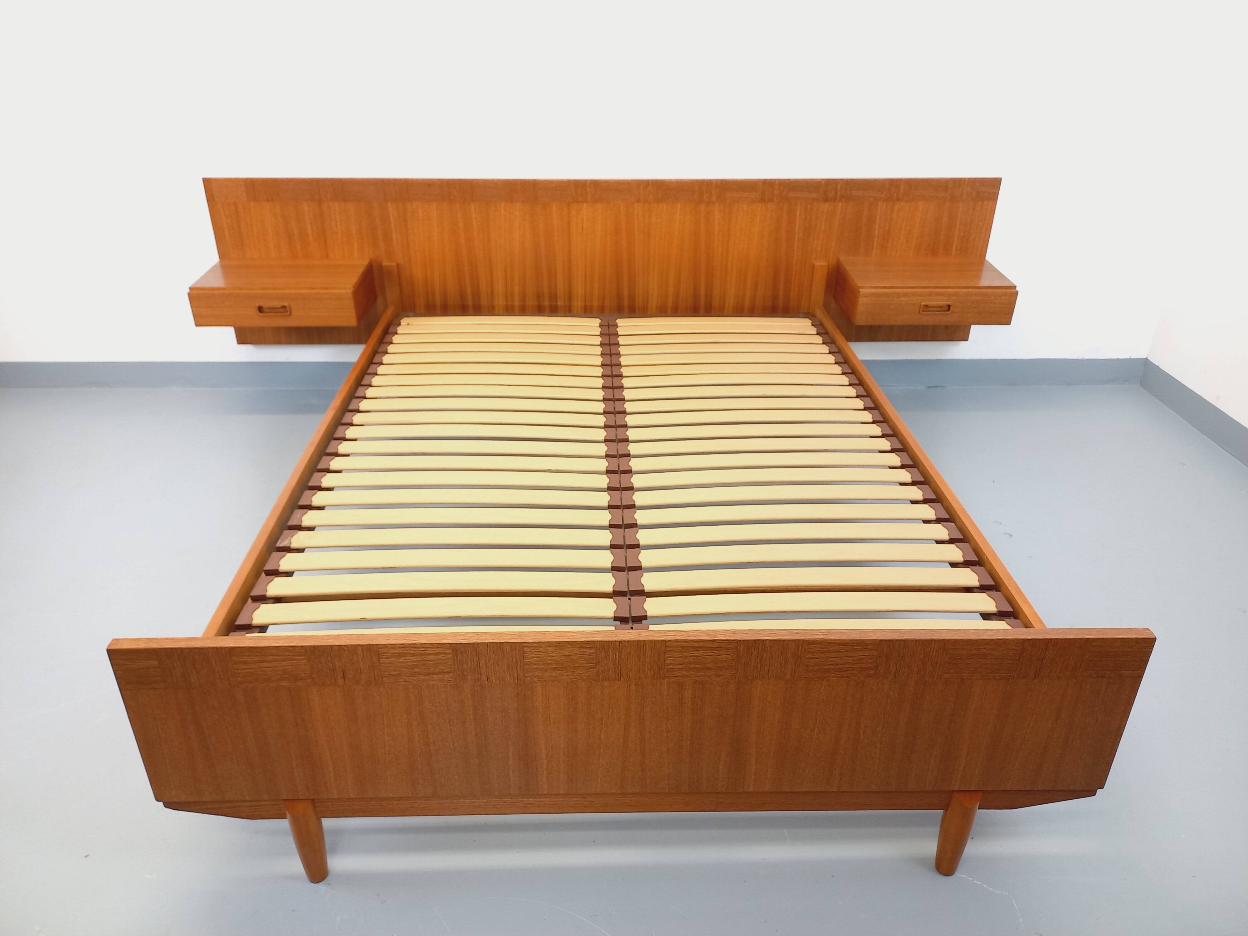 Double bed vintage Scandinavian in teak from the 1960s with integrated bedside tables.