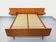 Double bed vintage Scandinavian in teak from the 1960s with integrated bedside tables.