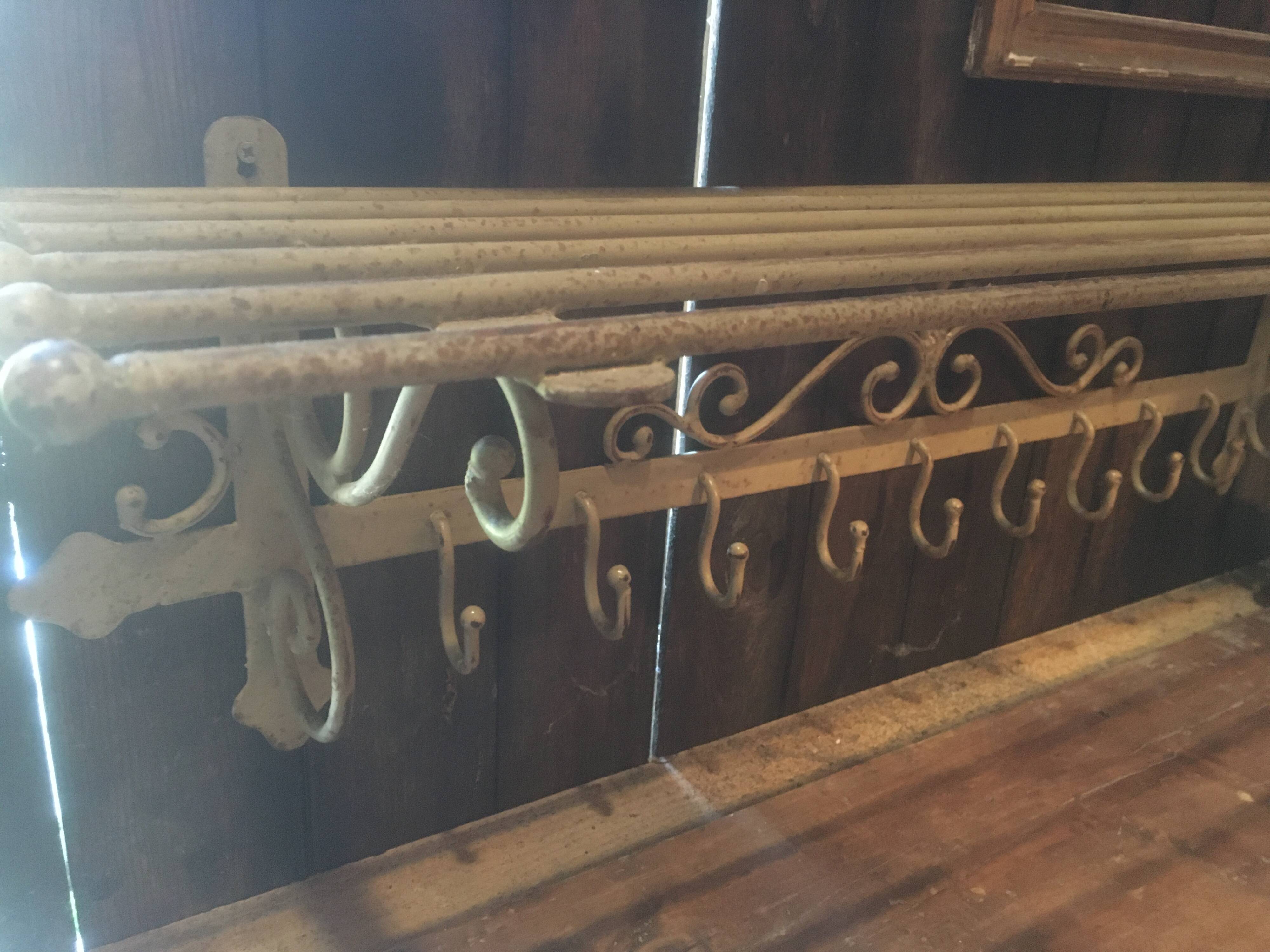 White wrought iron coat and hat rack