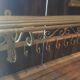 White wrought iron coat and hat rack