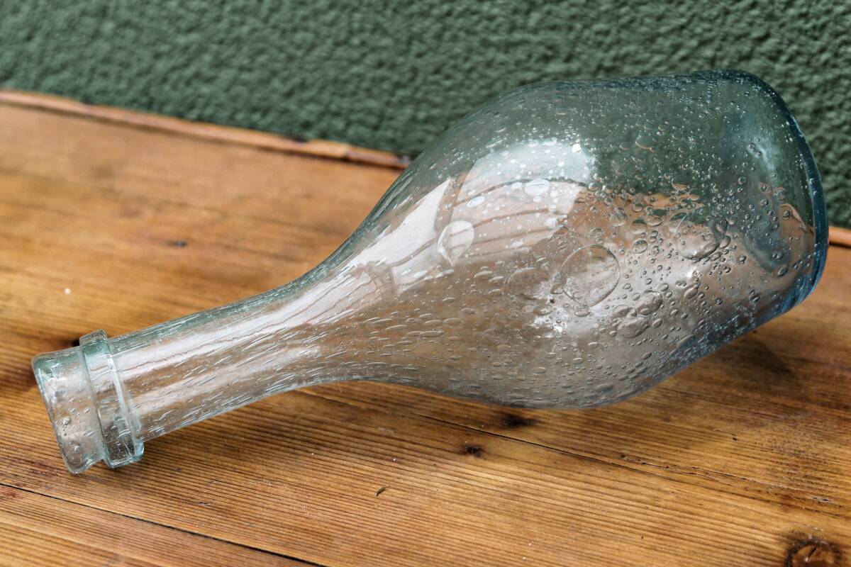 Biot blown glass bottle