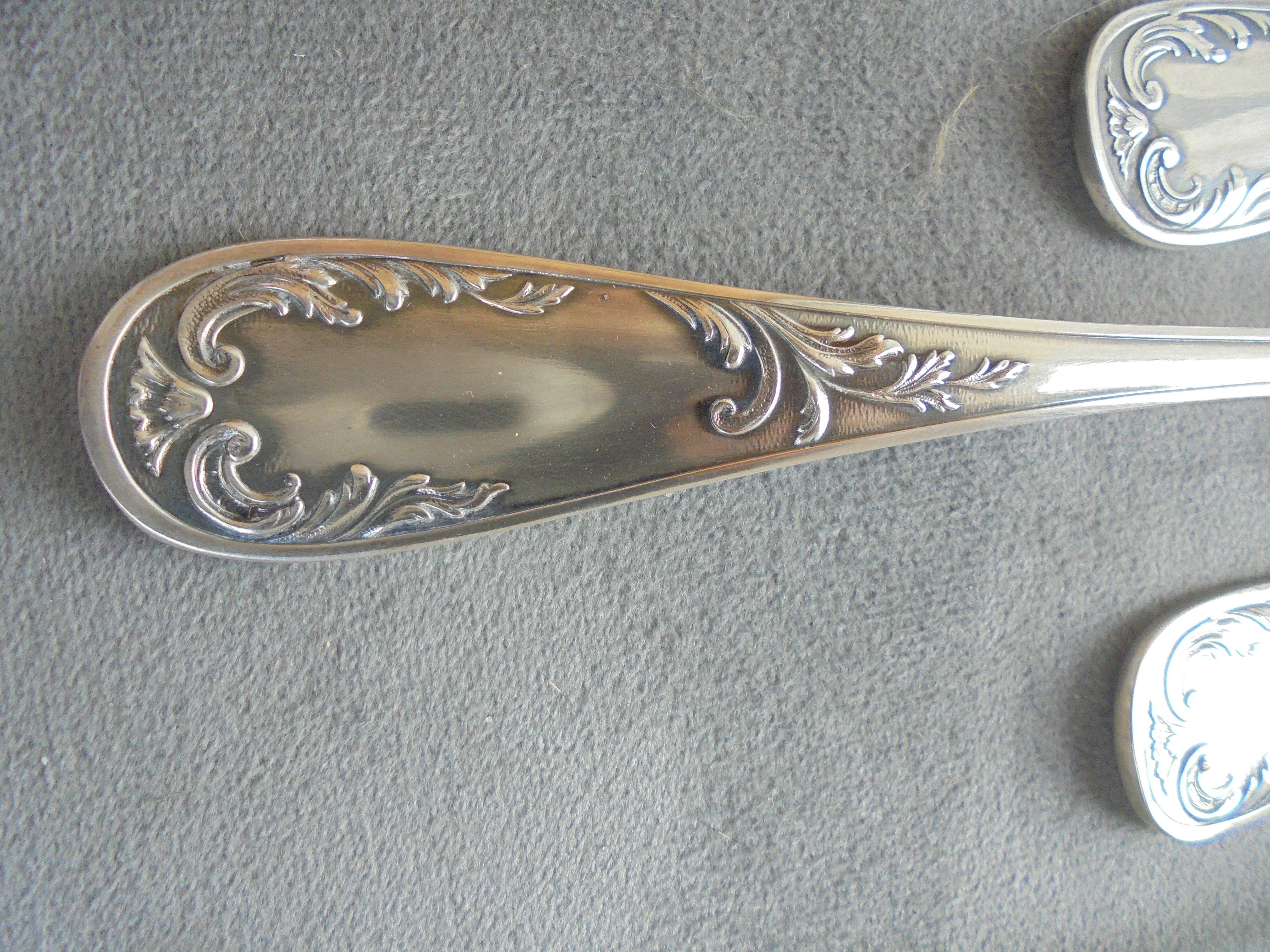 11 silver metal spoons