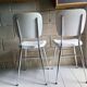 Pair of chrome and white 1960 skaï chairs