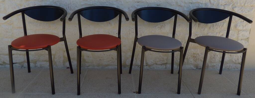 4 gondola-style chairs with a sturdy metal frame and faux leather.
