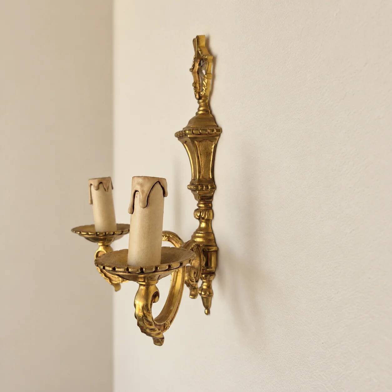 Set of four two-light wall sconces in gilded brass — Louis XVI style