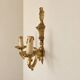 Set of four two-light wall sconces in gilded brass — Louis XVI style