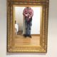 Mirror with large molded frame in gilded plaster with gold leaf