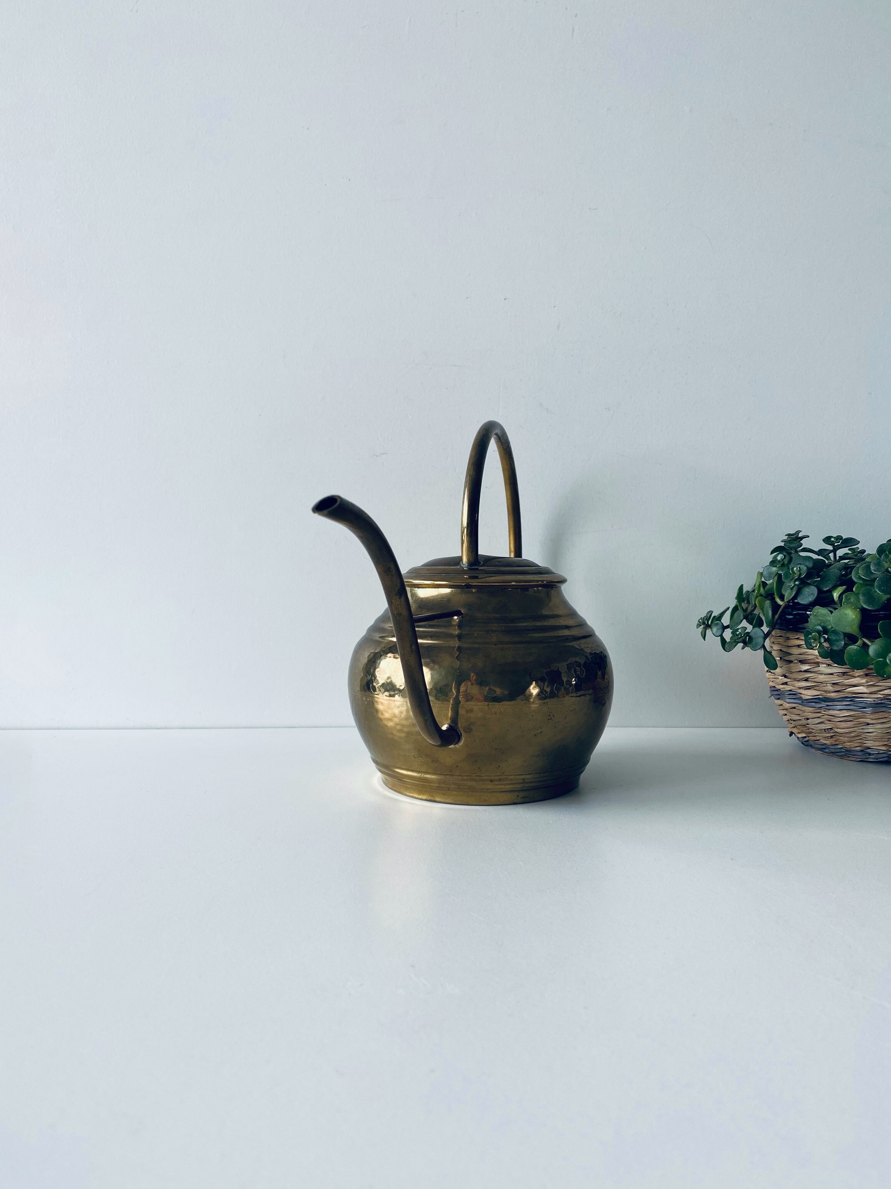 Old brass watering can