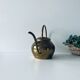 Old brass watering can