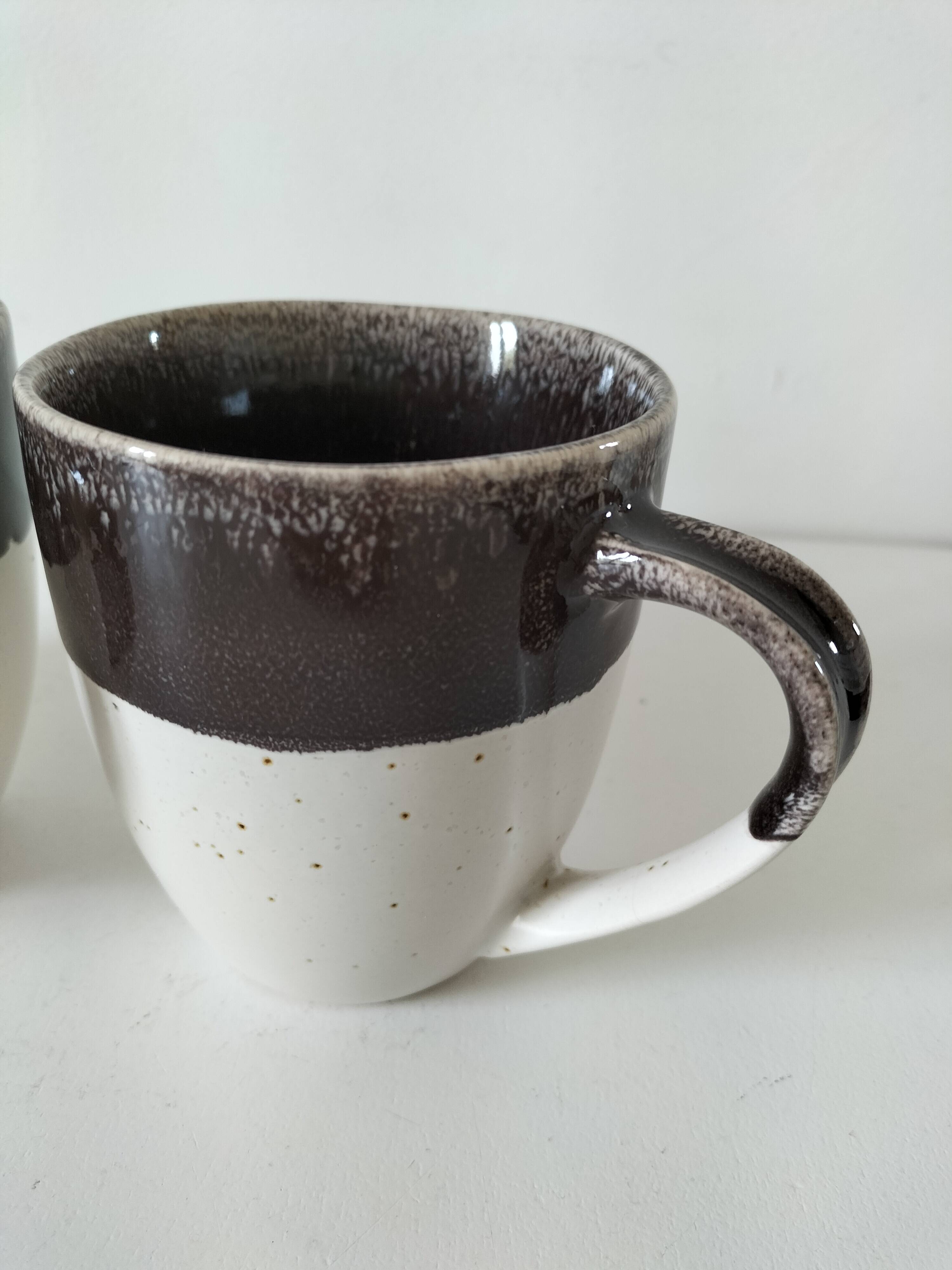 Set of three two-tone mugs, glazed stoneware, café workshop style.