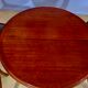 Round or oval table with four chairs in solid cherry, with extensions
