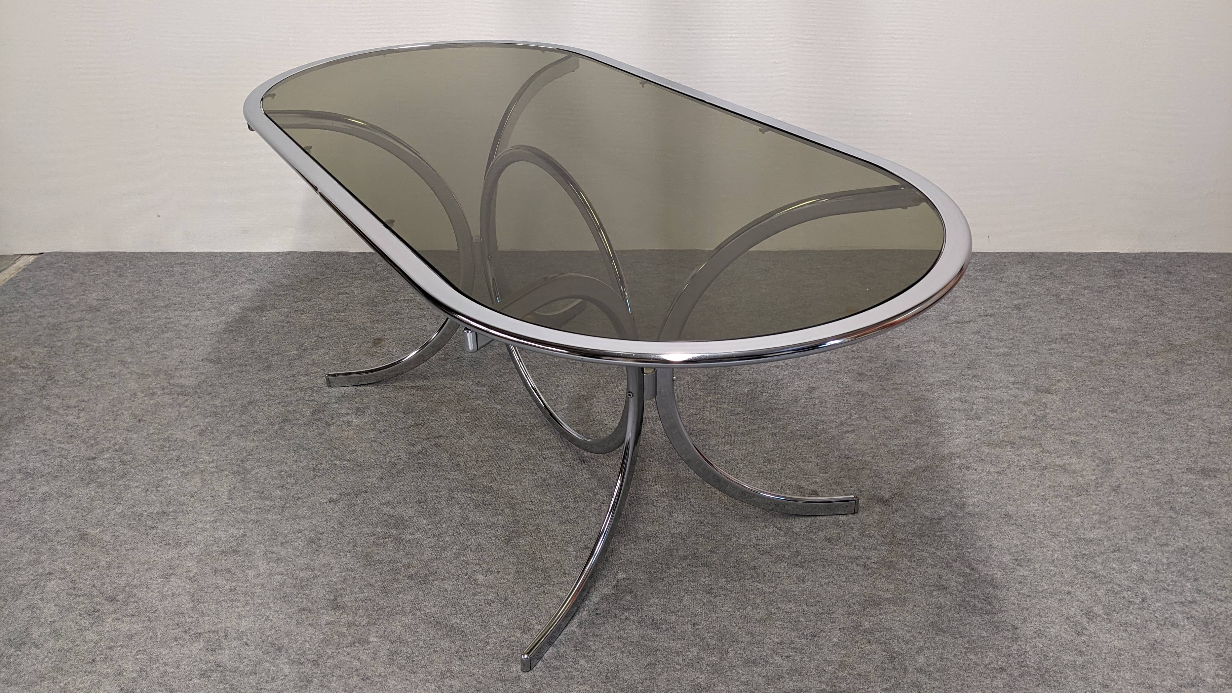 Chrome metal and smoked glass dining table, Italy circa 1970.