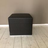 Pair of black synthetic rattan poufs from Flamant