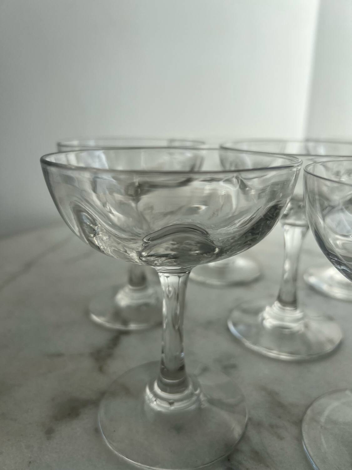 Set of seven blown glass stemmed glasses.