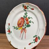 Easternth century earthenware plate, ribboned floral decoration