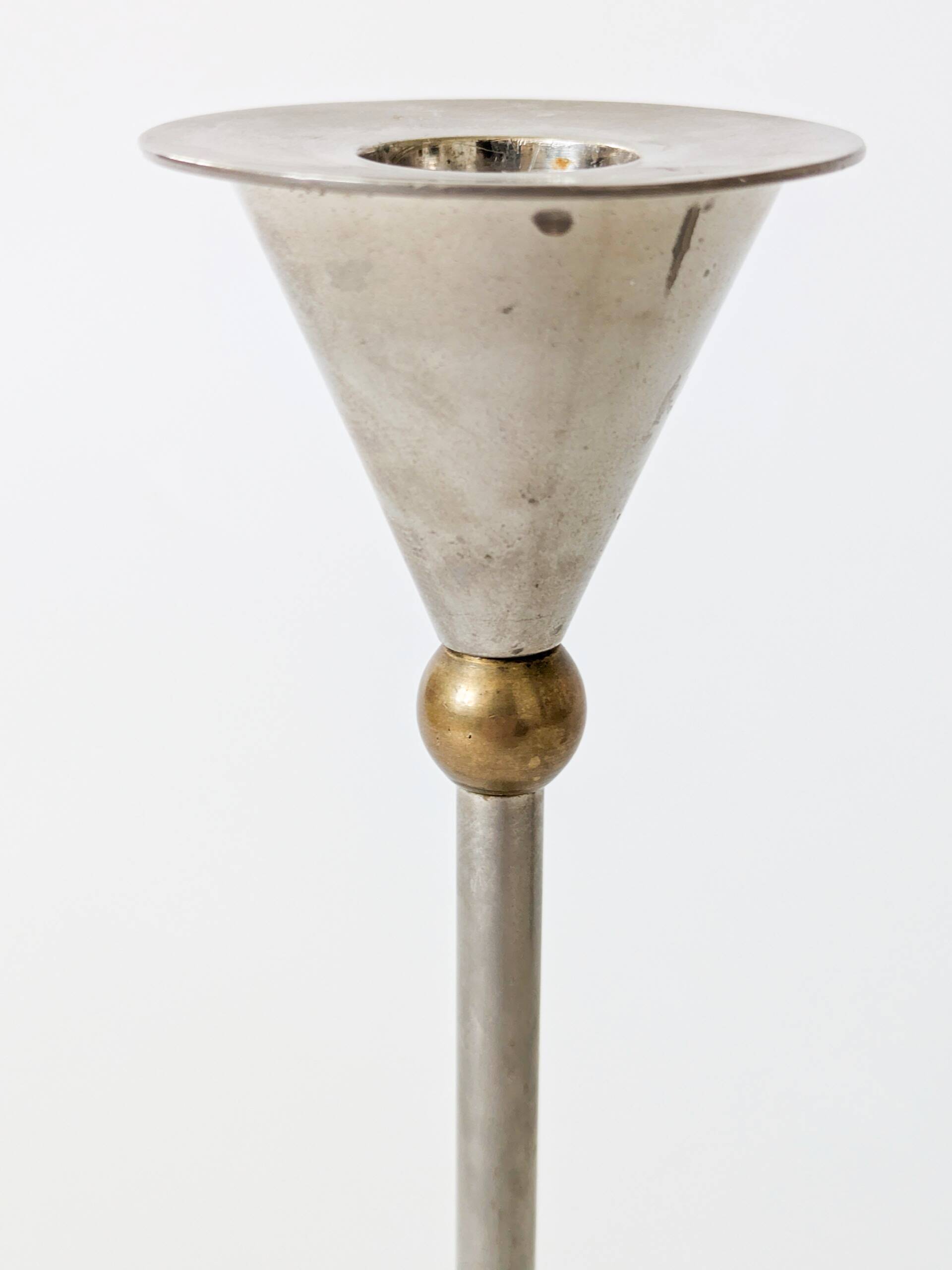 Pair of postmodern candlesticks in Memphis style made of steel and brass.