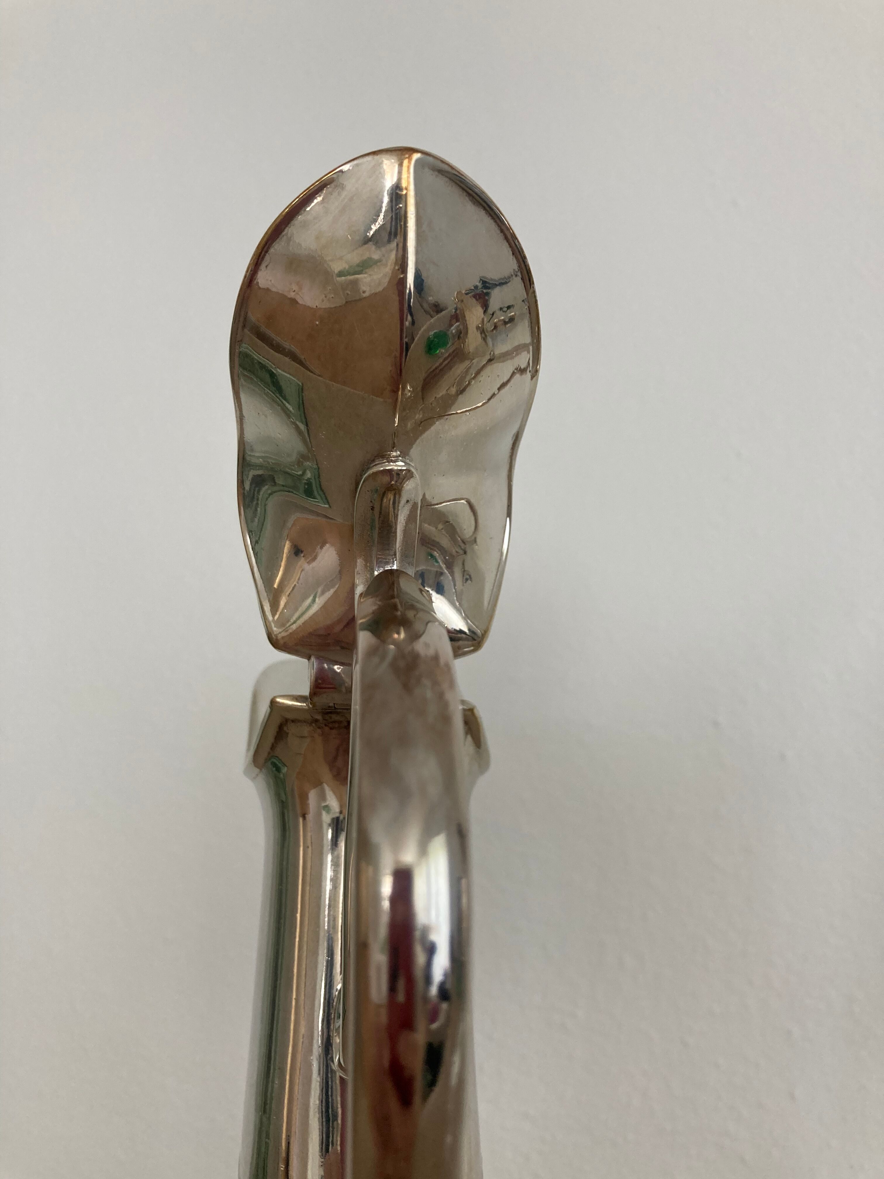 Glass decanters and silver metal spouts