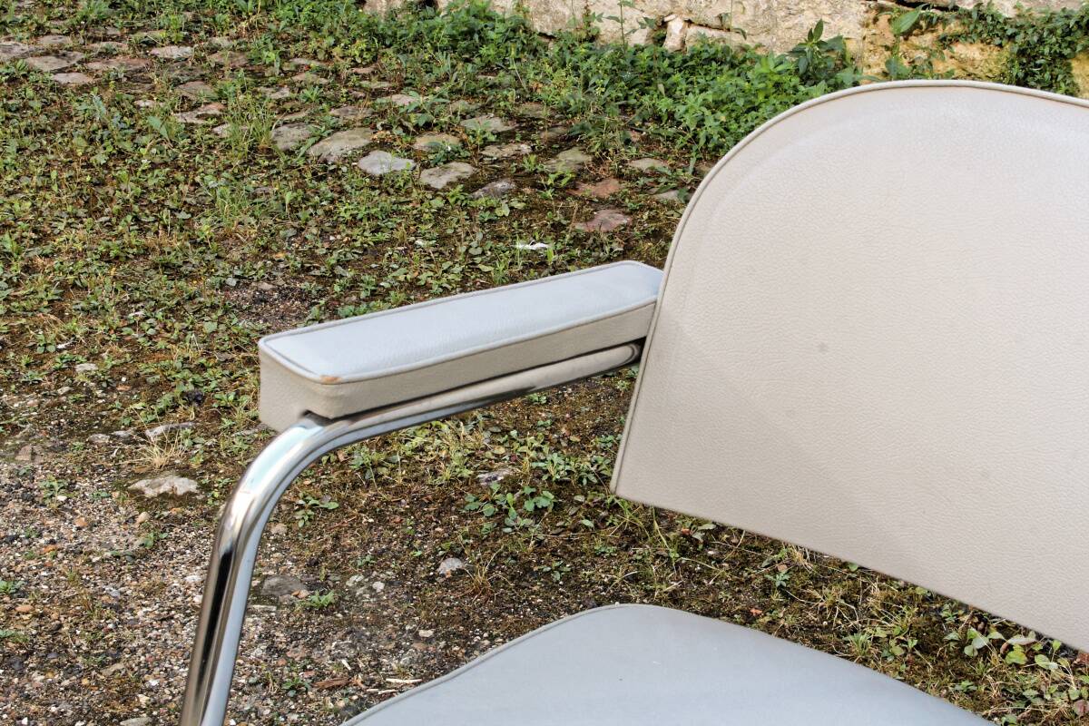 Set of 2 chairs and 1 armchair from the 70s in chrome metal and faux leather.