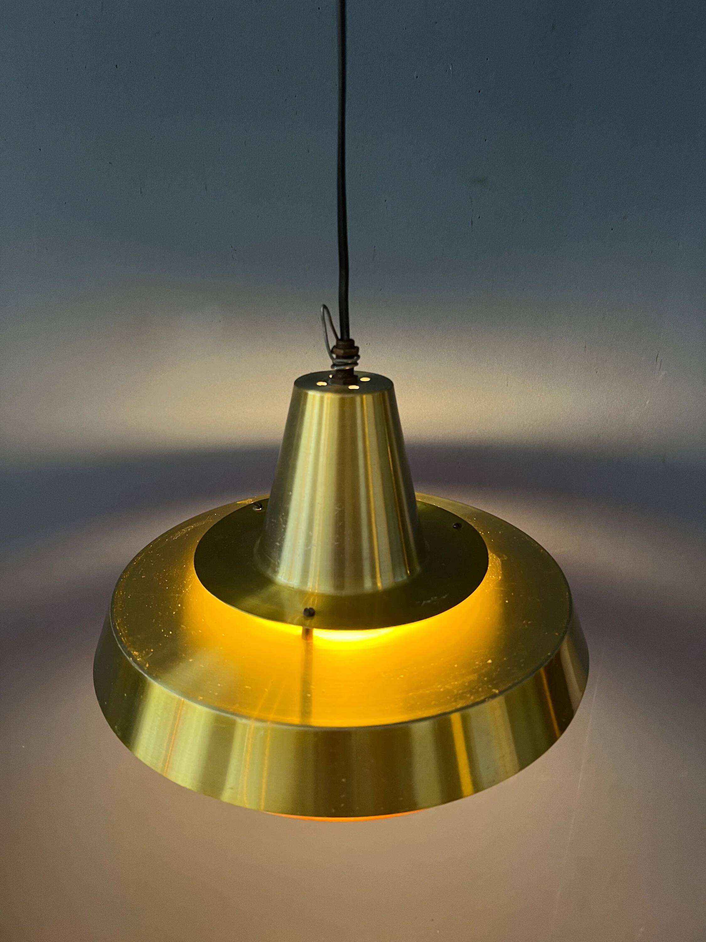 Mid-century Danish style orange brass suspension light.