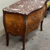 Curved and inlaid Louis XV style chest of drawers