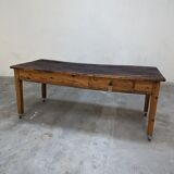 Farm table mounted on casters