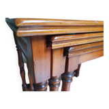 Nesting tables in solid cherry wood held together by slides