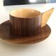 Vintage wooden cups and saucers in teak