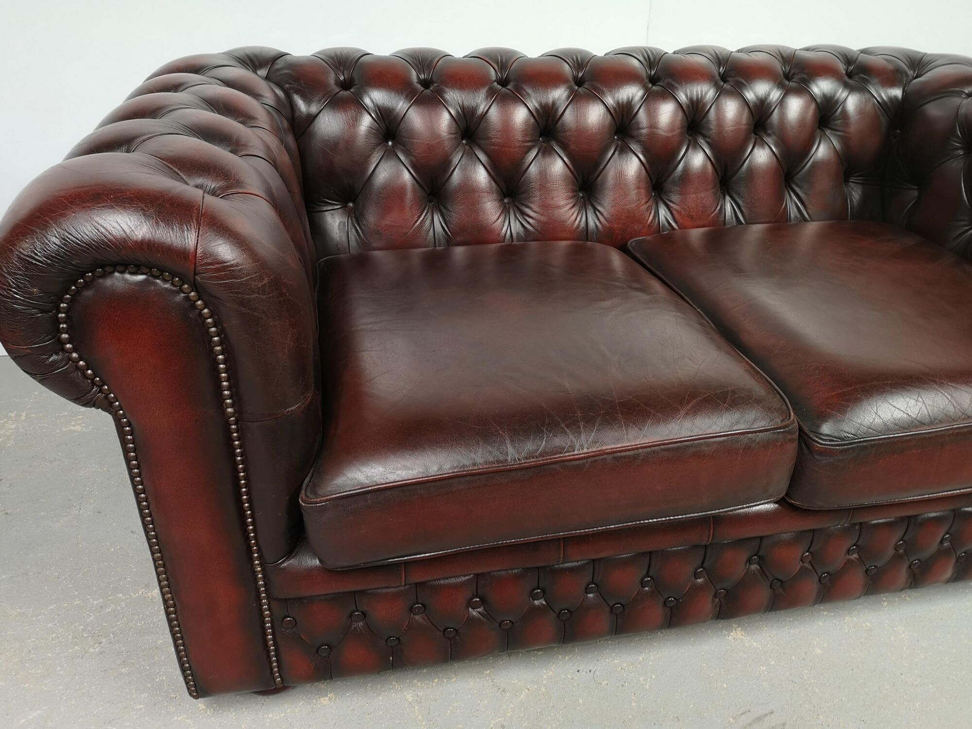 Convertible leather chesterfield sofa