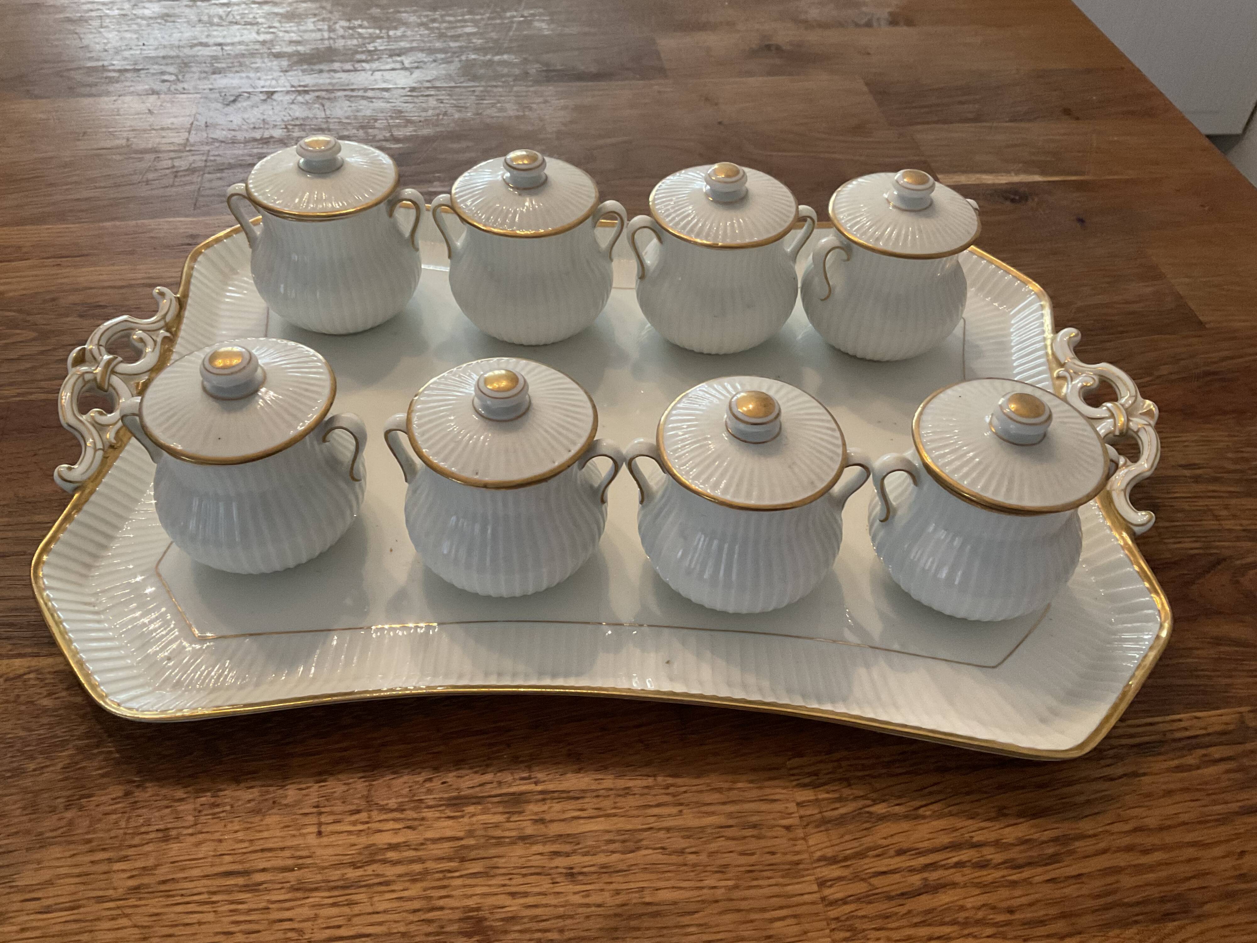 Porcelain tray and 8 matching cream pots. Antique
