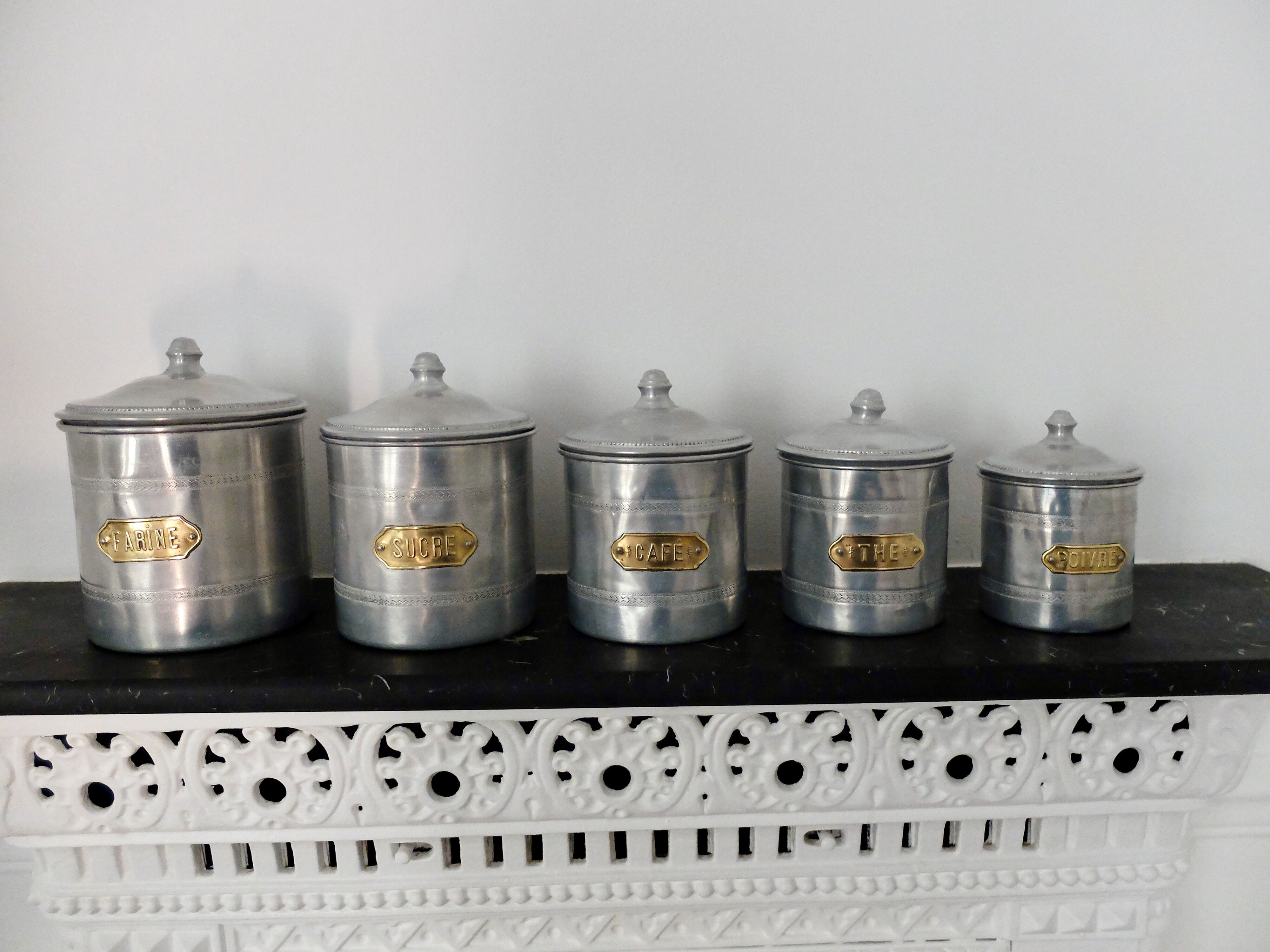Series of 5 tin spice pots