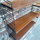 Vintage wood and metal shelves, designer storage.