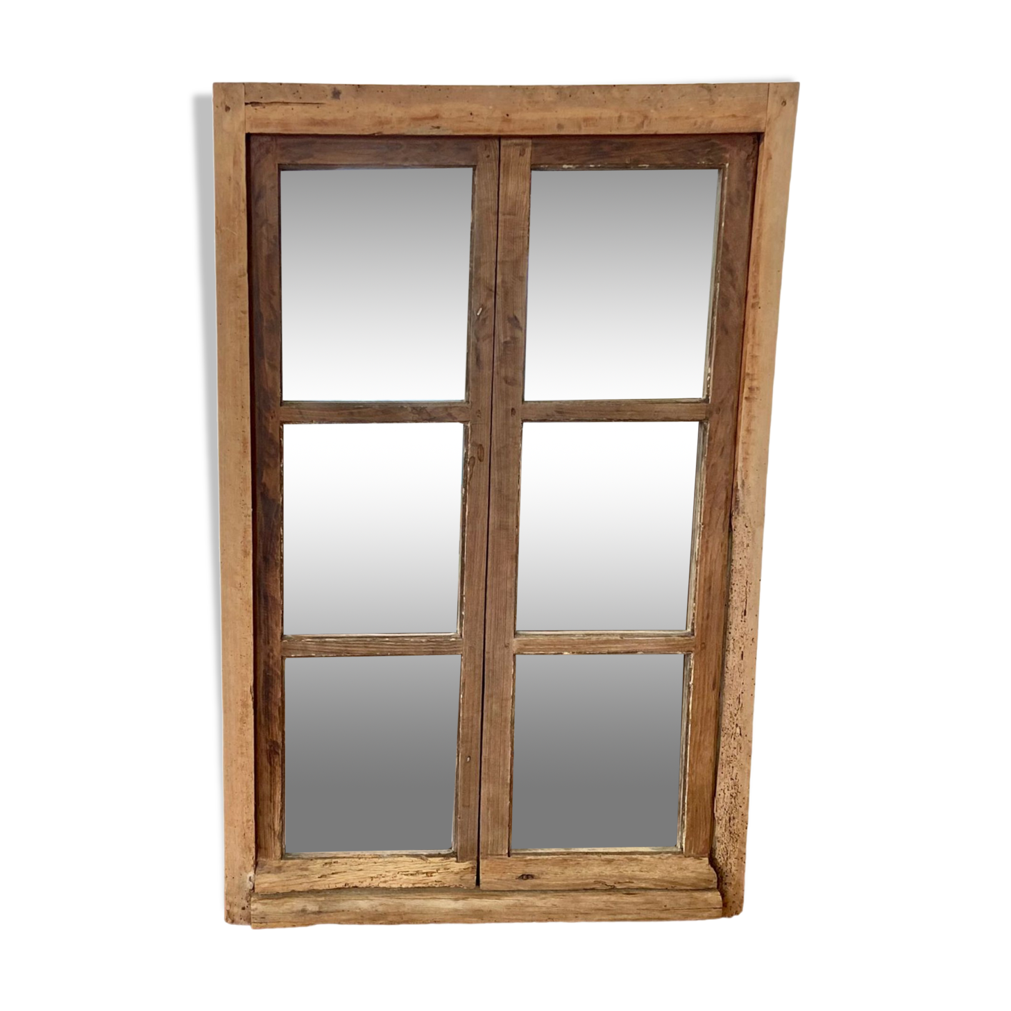 Mirror in old rustic window