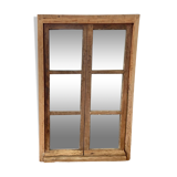 Mirror in old rustic window