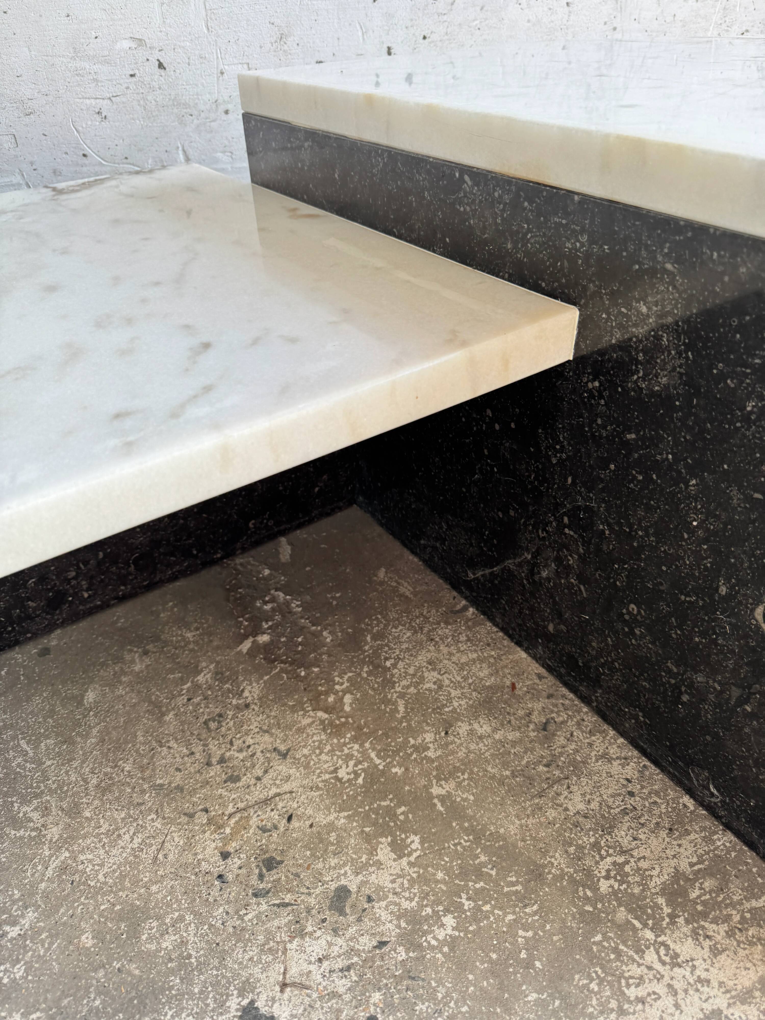Unique postmodern coffee table in marble and granite.