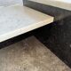 Unique postmodern coffee table in marble and granite.