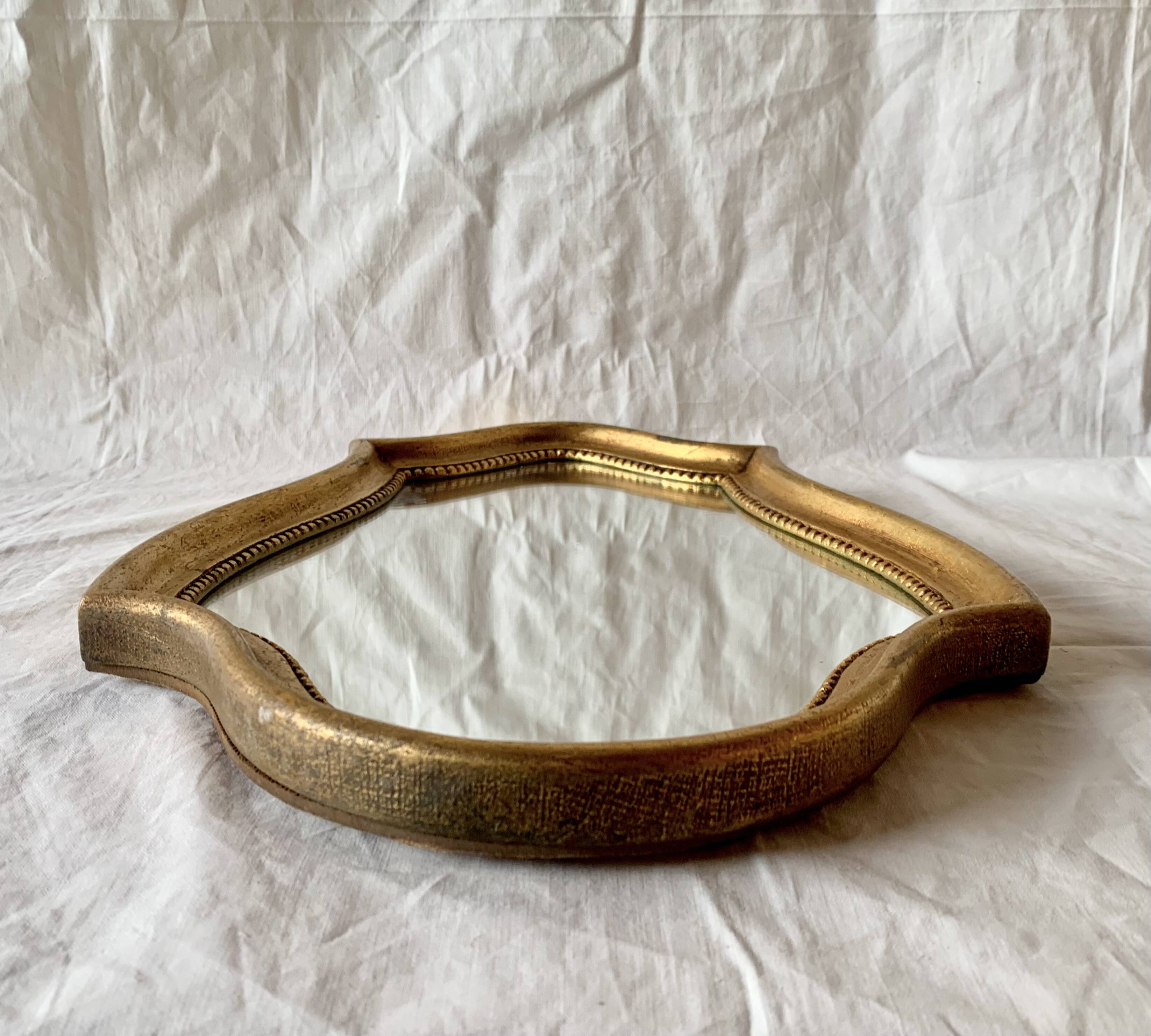 Vintage wall mirror in gilded wood